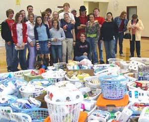 Local church youth group displays items they collected for Holiday Coalition